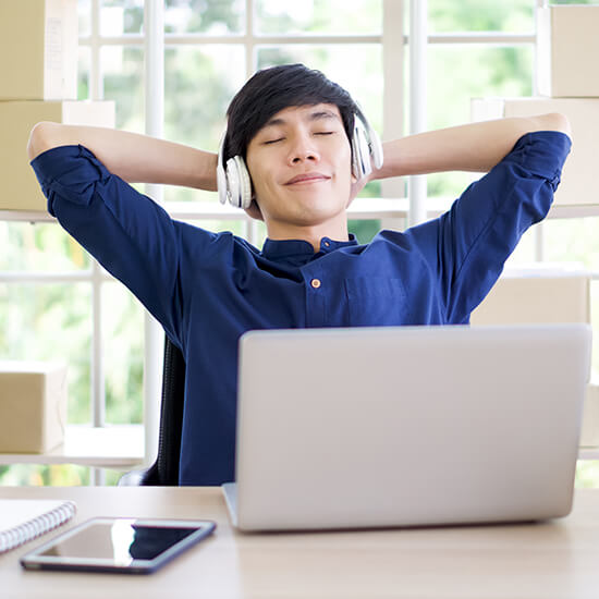 A boy relaxing and enjoying music, image implies health and wellness