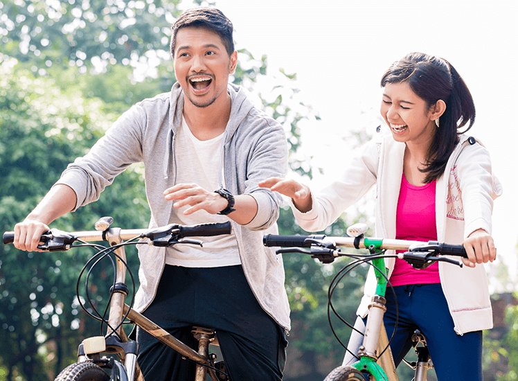 Couple cycling together promoting healthy lifestyle