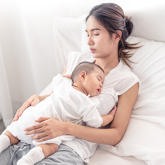 Infant Sleeping Peacefully on Her Mother's Chest, Image implies health and wellness