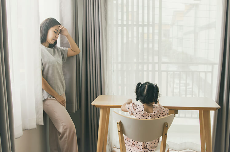Image of a irritated Mother and Her Child Sitting on a Chair, Image Implies Mental Health Management