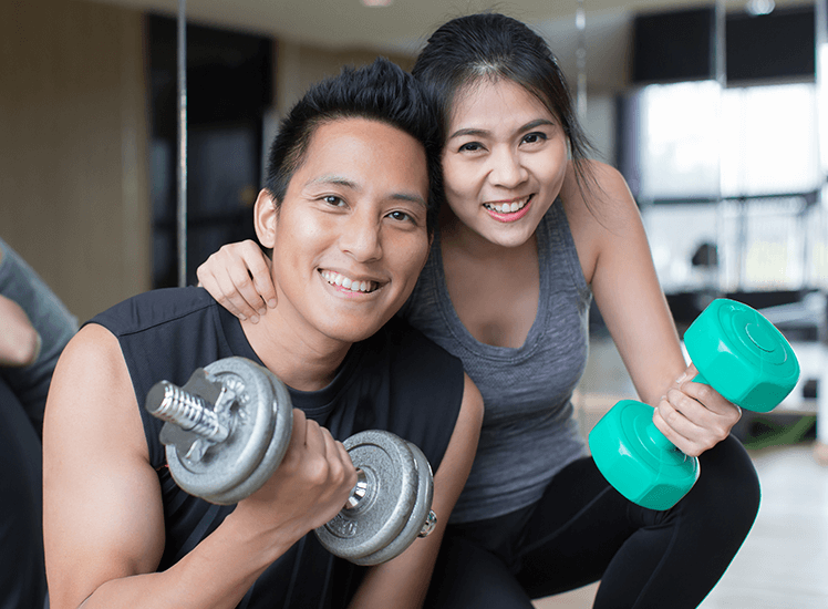 Boy and girl exercising at the gym, image depicts health and fitness