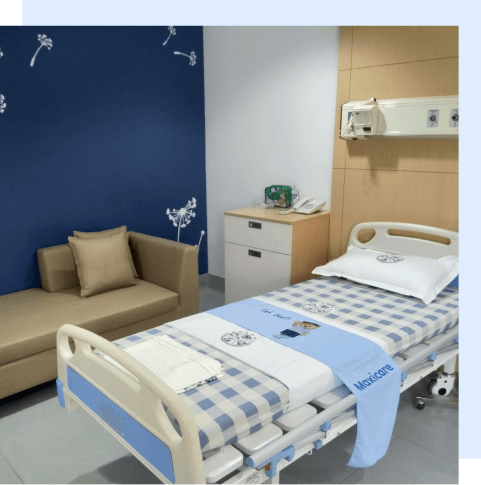 An empty bed in a Maxicare hospital room